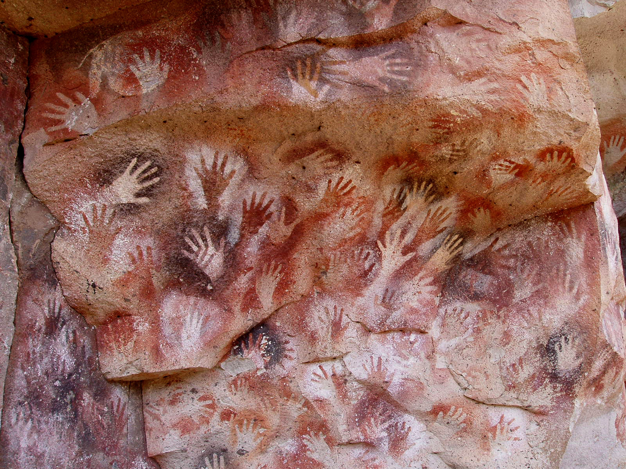 Cave painting of left hands in a cave from approximately 9,000 years ago